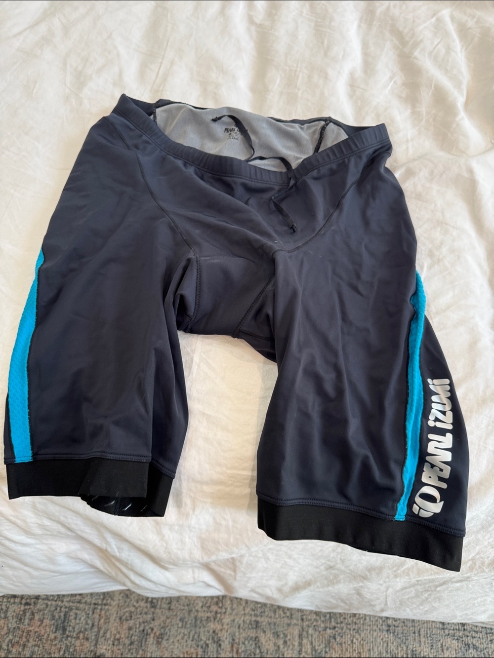Pearl Izumi Padded Men's Black Cycling Shorts with Turquoise Side Panels